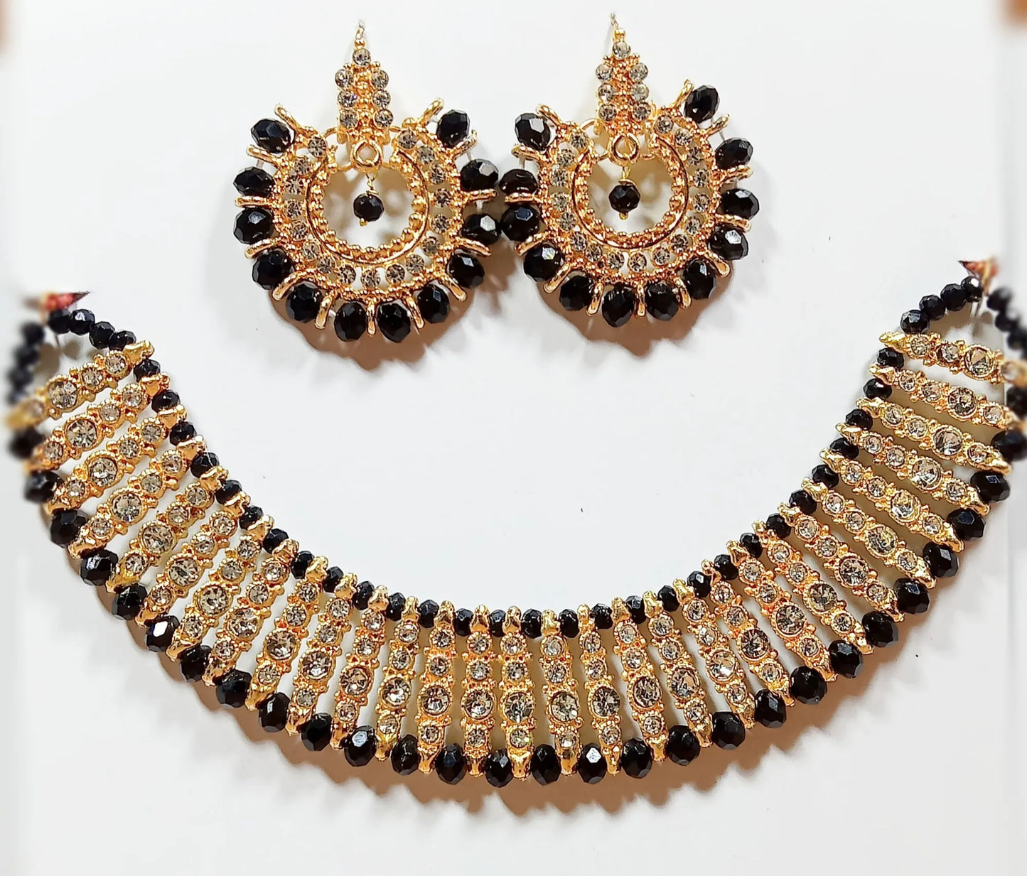 Black colour artificial jewellery set of round crystal earrings and chowker neckless